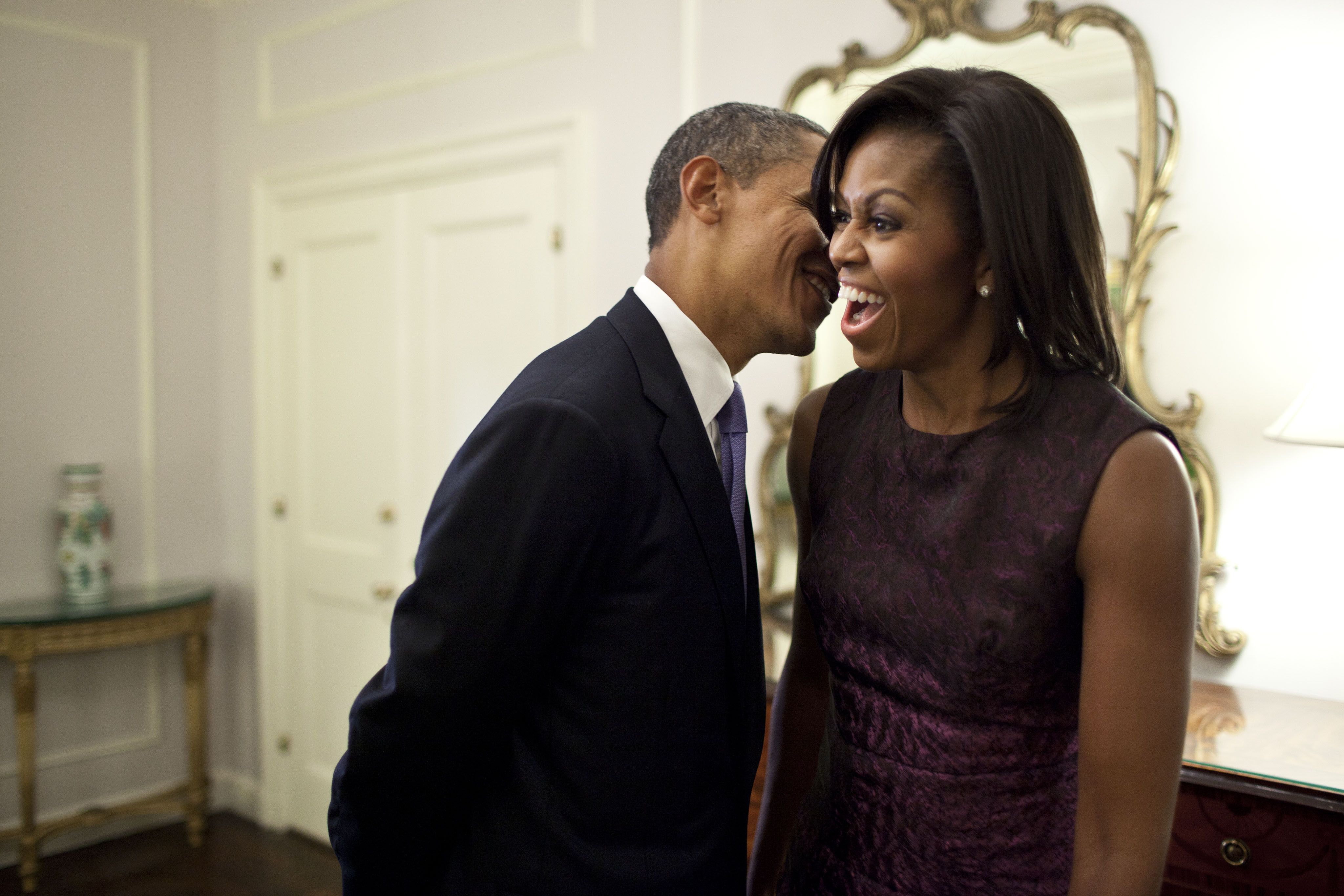 Sept. 21, 2011 "The First Lady reacts to something the President whispered to her at the Waldorf Astoria Hotel in between events related to the United Nations General Assembly in New York City." (Official White House Photo by Pete Souza) This official White House photograph is being made available only for publication by news organizations and/or for personal use printing by the subject(s) of the photograph. The photograph may not be manipulated in any way and may not be used in commercial or political materials, advertisements, emails, products, promotions that in any way suggests approval or endorsement of the President, the First Family, or the White House.